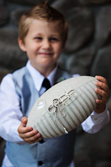 My nephew carried our rings out on a football. Purchased on Etsy. Photos by Atelier Pictures in Portland. #footballwedding #ringbearer #wedding. Sports wedding ideas. Football ring bearer. Sporty Wedding Ideas, Sports Wedding Ideas, Picture Of A Football, Football Wedding Theme, Etsy Photos, Sports Themed Wedding, Football Wedding, Prewedding Ideas, Wedding Captions