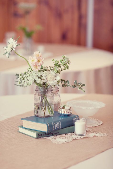 Book Wedding Table Decor, Centerpiece With Books And Flowers, Wedding Table Centerpieces Books, Book Centrepiece Wedding, Wedding Bouquets Ideas, Burlap Runner, Book Centerpieces, Bouquets Ideas, Table Arrangements Wedding