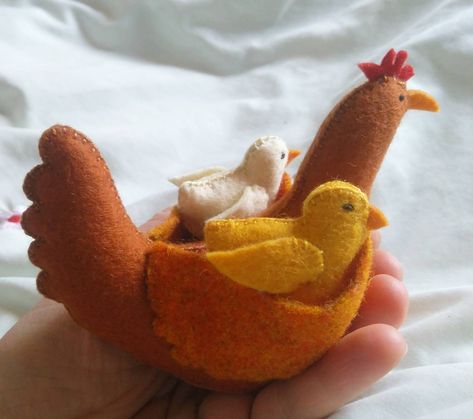 This beautiful wool felt hen with chick made out of Hungarian wool felt. Its body is stuffed with natural wool. Its eyes  were made using cotton thread. The cute hen and chick is made with love. Made by hand. Designed from scratch by me including felting pattern and decoration.  The materials are high quality, all natural, and the construction is sturdy. The beautiful hen and chick is a perfect  providing so many benefits for toddlers, preschoolers and up.  The role play game play promotes intellectual development, plays an important role in social and emotional development.  It develops imagination, fantasy, thinking, differentiated development of perception. Each item I make is an original and distinct, so item you will receive may not be the exact one in the photo. Hoewer, your item wil Felt Chicken, Farm Animal Nursery Decor, Animal Felt, Farm Animal Nursery, Giraffe Toy, Felt Animal, Wool Animals, Felt Gifts, Natural Toys