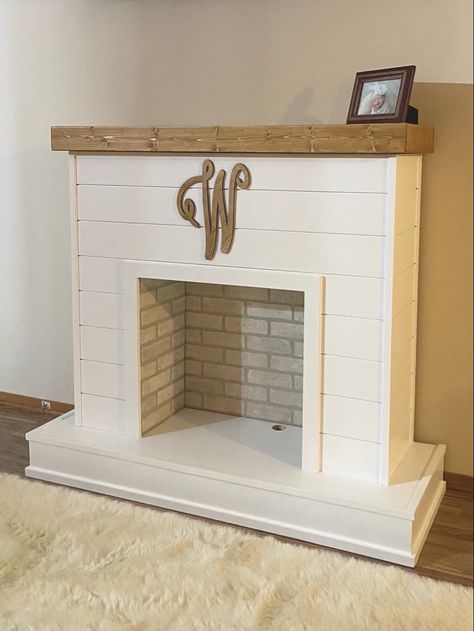 Fake Shiplap Fireplace, Coastal Freestanding Fireplace, Wood And White Fireplace, Fake Fireplace Apartment, Diy Movable Fireplace, Diy Free Standing Fireplace, Built In Faux Fireplace, Fake Fireplace For Christmas, Free Standing Electric Fireplace Ideas