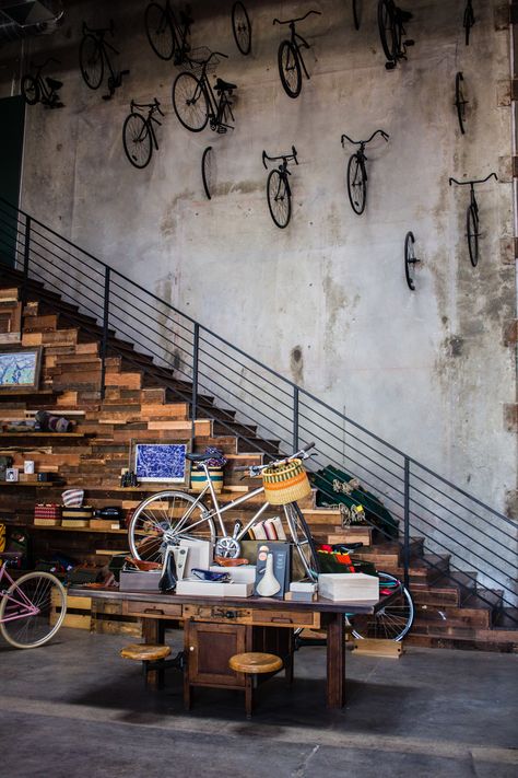 The Wheelhouse is a full service bicycle shop and barista-led coffee shop in Los Angeles' Arts district that aims to bring people together. Bicycle Coffee Shop, Bicycle Shop Design, Bicycle Cafe, Bike Shops, Cycle Store, Coffee Bike, Bicycle Store, Wood Staircase, Bicycle Shop