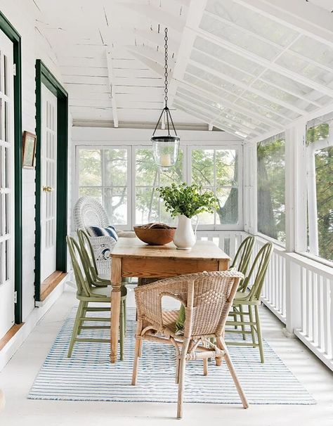 Have a screened-in porch but aren't sure what to do with it? Or are you thinking about adding a screened-in porch to your home and want some ideas? Choosing the right design elements and decor pieces for your screened porch is crucial to creating a space you will use and enjoy as much as possible! These simple screened-in porch ideas will give you tons of inspiration, whether you are just dreaming up building plans or you want to add some comfort and ambiance to your existing porch. Porch Windows Ideas Sunrooms, Vaulted Ceiling Screened Porch, Screened In Porch Ceiling Ideas, Screened In Porch Ideas On A Budget, Screened Porch Dining, Indoor Porch Ideas, Simple Screened In Porch, Porch Table And Chairs, Cozy Screened In Porch