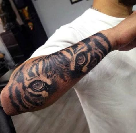 tattoo tiger eyes forearm men designs tattoos animal eye realistic inspiration ink outer lion nextluxury sleeve male mens tatoo meaning Tiger Forearm Tattoo, Natur Tattoo Arm, Tiger Eyes Tattoo, Arm Tattoos For Guys Forearm, Tiger Tattoo Sleeve, Forearm Tattoo Quotes, Half Sleeve Tattoos Forearm, Tattoo Eye, Tattoo Tiger