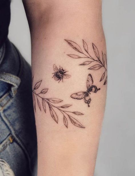 37 Stunning Armband Tattoos For Women - Our Mindful Life Welsh Tattoo, Butterfly Flower Tattoo, Butterfly With Flowers Tattoo, Garden Tattoos, Wrap Tattoo, Tiny Butterfly, Wildflower Tattoo, Flower Tattoo Shoulder, Vine Tattoos