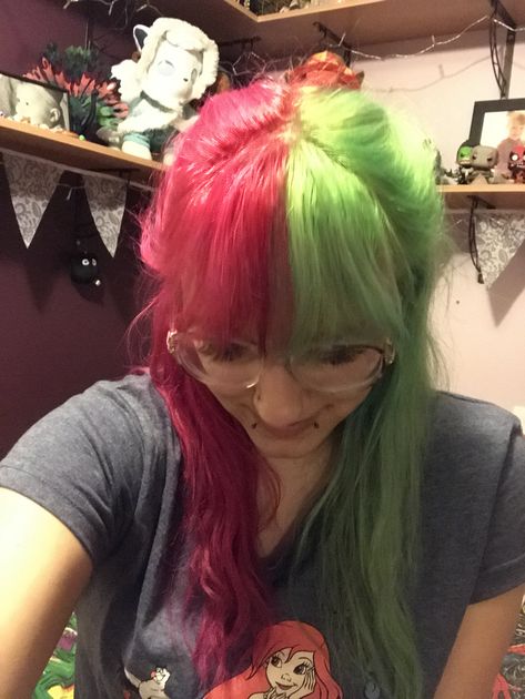 Half pink half green hair dyed with directions Split Dyed Hair Pink And Green, Green And Red Hair Color, Green And Pink Split Dye, Half Green Half Pink Hair, Pink And Green Hair Split, Pink And Green Hair Dye Ideas, Green And Pink Hair Color, Pink And Green Hair Dye, Half Split Hair Color