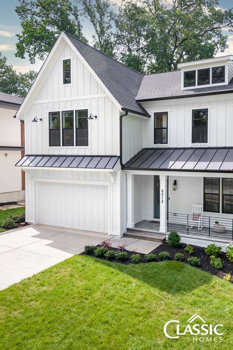 An exterior image of a white modern farmhouse of board and batten, half porch, black iron rails. Flagstone Front Porch, Barn Style Garage, Hardy Plank Siding, Farmhouse Style Exterior, Farmhouse Craftsman, Spec Home, Hardie Board, House Awnings, Board And Batten Exterior