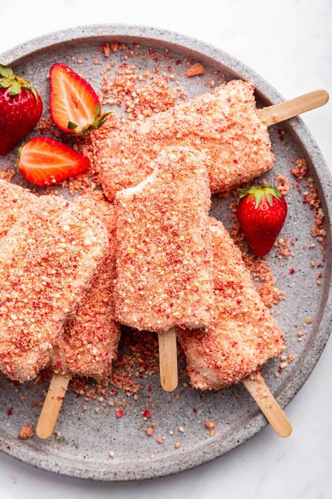 These strawberry shortcake ice cream bars put a homemade spin on a childhood favorite! With a creamy strawberry inside and crunchy shortcake bits on the outside, they’re sure to be a hit. Strawberry Ice Cream Bar, Strawberry Shortcake Ice Cream Bars, Ice Cream Bar Recipe, Frozen Treats Recipes, Homemade Strawberry Shortcake, Strawberry Shortcake Ice Cream, Ice Cream Bars, Ice Cream Mixture, Frozen Dessert Recipe