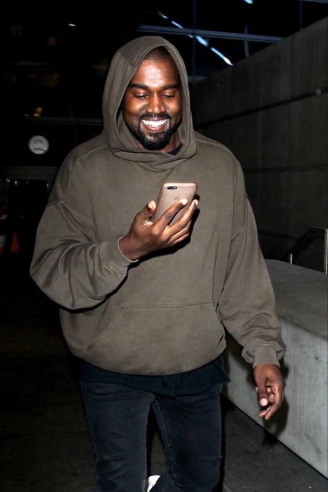 Guy On Phone, Goofy Kanye Pics, Iconic Kanye West Photos, Kanye West Smiling At His Phone, Kanye Taking Picture, Rare Kanye Photos, Kanye West Smiling, Smiling Man, Black Orchid