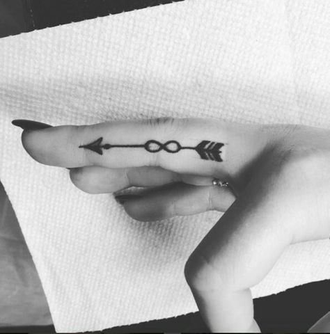 Arrow tattoo with infinity symbol Wedding Ring Finger Tattoos, Tattoo Arrow, Love Symbol Tattoos, Serpent Tattoo, Small Finger Tattoos, Finger Tats, Finger Tattoo For Women, Ring Finger Tattoos, Dragon Tattoo For Women