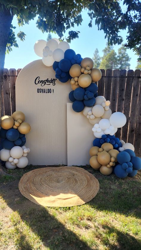 Navy Blue Balloon Backdrop, Graduation Theme Backdrop, Navy And Gold Grad Party, Navy Gold And White Graduation Party, Blue White Brown Balloon Arch, Balloon Garland For Graduation, College Backdrop Ideas, Graduation Backdrop Ideas 2024, Navy Blue Balloon Arch