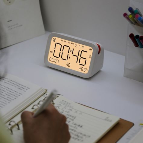 Behold the specifics of this modern and functional Alarm Clock. Engineered with precision, this state-of-the-art accessory measures 100mm in diameter and 1300mm in length. Crafted from high-grade plastic, the design is trendy yet functional, perfect for contemporary decor. This advanced Alarm Clock comes with an easy-to-navigate Snooze function, allowing for those precious extra few minutes of sleep. What’s more, it possesses a Sleep with Backlight attribute, ensuring you never struggle to Cool Alarm Clocks For Teens, Digital Desk Clock, Smart Alarm Clock, Study Timer Clock, Digital Alarm Clock Aesthetic, Room Accessories Aesthetic, Futuristic Clock, Alarm Clock Aesthetic, Digital Clock Design