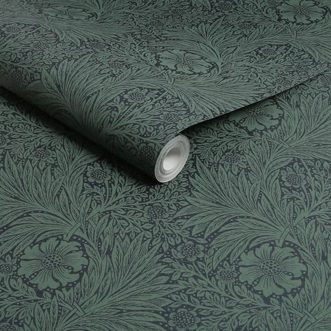 A full roll of this product is 20.5 inches wide and 396 inches long. A full roll can cover up to 56 square feet depending on the design match and pattern repeat. A sample of this product is 8 inches by 11 inches. Marigold was designed by William Morris and registered as a wallpaper in 1875. The pattern incorporates larger marigold flowers amongst sprays of willow-like leaves in a sub-pattern of smaller foliage and flowers. The monochrome pattern was produced in a wide variety of colorways. Morri Masculine Wallpaper Office, William Morris Green Wallpaper, Vintage Wallpaper Design, William Morris Wallpaper Bathroom, Green Wallpaper For Bedroom, Green Wallpaper Living Room, Pantry Wallpaper Ideas, Dark Green Floral Wallpaper, Beautiful Forest Wallpaper