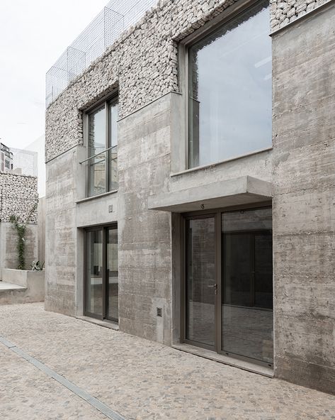 corpo atelier unveils three exposed concrete and stone facades in portugal Exposed Concrete Facade, Mad Architects, Faro Portugal, 2023 Picture, Concrete Facade, Metal Grid, Stone Facade, Concrete Stone, Exposed Concrete