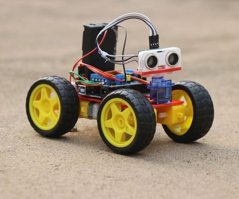 How to Make Obstacle Avoiding Car Using Arduino: Hey guys in this project I have made an Obstacle avoidance car that uses arduino, This robotic car will automatically avoid going in the path of any obstacles! How cool is that?  This robot car serves as an ultimate source of learning if you are will… Arduino Robot, Portable Tv, Electronics Mini Projects, Car Projects, Electronics Projects, Arduino, 3d Printing, Electronics