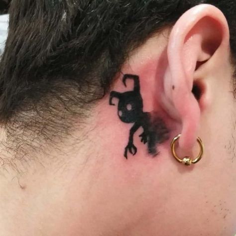 Black Scary Monster Behind Ear Tattoos Black Girl Skull Behind Ear Tattoo, Goth Behind Ear Tattoo, Tiny Demon Tattoo, Below Ear Tattoo, Behind Tattoos Ear, Scary Small Tattoos, Under Ear Tattoo Men, Scary Tattoos For Men, Cute Monster Tattoo