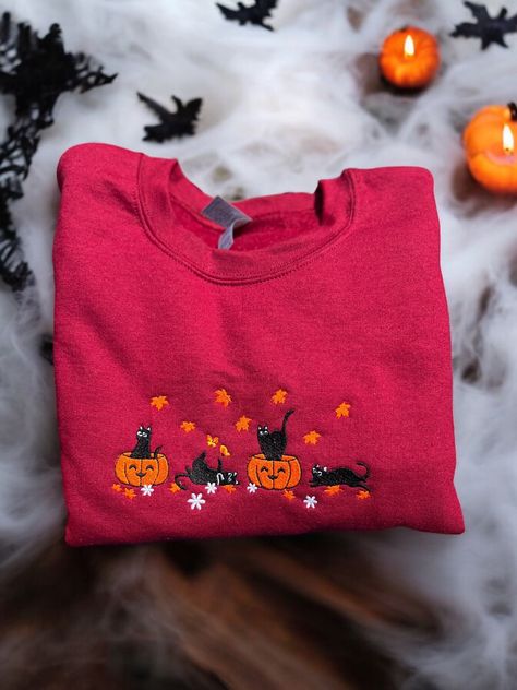 cat sweater, halloween crewneck, fall sweatshirt, halloween sweatshirt, fall crewneck, womens sweatshirt, embroidered sweater, kitten shirt This cat sweatshirt is the perfect way to add some comfort and style for your fall wardrobe.  Embrace the sweater weather cozy season with my handmade embroidered sweatshirts. Cute sweatshirt is embroidered with love and special care to detail.  Makes a great fashion staple for halloween. **Materials** Made with a soft fleece lined sweatshirt, 50% polyester, Cute Halloween Sweaters, Crewnecks For Women, Funky Sweaters, Big Comfy Sweaters, Tshirt Inspiration, Sweatshirts Cute, Crewneck Outfit, Kitten Shirt, Fall Crewneck Sweatshirt