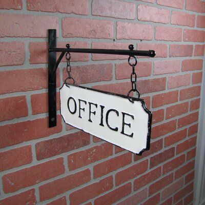 Pinpoint your office with this rustic, vintage-style metal flange sign. Made from a strong, durable cast iron, this white wall plaque features a metal sign that reads "OFFICE" hung from a bracket and chains. A raised black border, embossed black lettering, and weathered, distressed enamel finish makes this wall sign look like it’s been hanging on your wall for years. This hanging office sign is perfect decor for your home office, business, man cave, and even adds a little humor outside the bathr Admin Ideas, Office Update, Metal Signage, Office Signage, Sidewalk Sign, Shop Signage, Piece Sign, Farm Signs, Office Signs