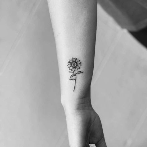 Small Black Sunflower Tattoo, Simple Small Flower Tattoos Sunflowers, Small Sunflower Wrist Tattoo, Tattoo Sunflower Arm, Tattoo Of Sunflowers, Sunflower Heart Tattoo Small, Sunflower Tattoo Ideas Small, Wrist Sunflower Tattoos For Women, Flower Tattoo Side Of Wrist