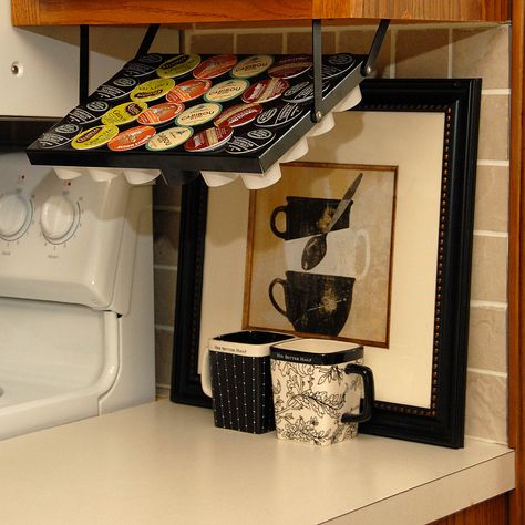 Do you own a Keurig and need a way to store all those K-Cups? Check out www.coffeekeepers.com Coffee Keepers are precision, all-steel K-Cup storage units that mount under cabinets and conveniently swing down for use. K Cup Storage, K Cup Holders, Clever Kitchen Storage, Cup Storage, Kitchen Storage Hacks, Kitchen Hacks Organization, Diy Holder, K Cups, Counter Space