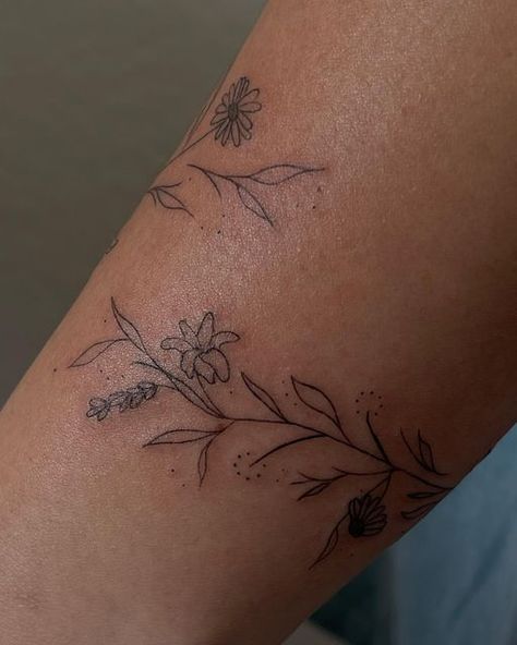 Dainty Leaf Vine Tattoo, Small Flower Wrap Around Tattoo, Plant Tattoo Wrap Around Arm, Dainty Arm Wrap Tattoos For Women, Line Art Tattoos Back, Leaf Flower Wrap Around Tattoo Arm, Meaningful Wrap Around Tattoo, Fine Line Flower Wrap Tattoo, Wrap Leaves Tattoo