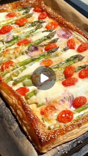 Mediterranean Diet Meal on Instagram: "🫒🥘 CHEESY ASPARAGUS PUFF PASTRY TART.

💁‍♀️ Type "Puff" If You Want to Get More Recipes From @mediterraneandiet_meal

👋 Follow @mediterraneandiet_meal to Get Daily Mediterranean Recipes

👉 INGREDIENTS
1 sheet puff pastry (275 g)
400 g asparagus
3 tbsp crème fraîche
100 g mozzarella grated
125 g mozzarella balls
50 g Parmesan shaved
A handful of cherry tomatoes
1 small red onion
1 egg yolk for greasing the edges
2 tbsp sesame seeds (for the edges
3 tbsp honey
Salt to taste

INSTRUCTIONS
Preheat your oven to 180°C (356°F).
On a clean and lightly floured surface, roll out the puff pastry. Transfer it to a large baking sheet lined with parchment paper. With a sharp knife, lightly score a 2 cm border around the edges of the puff pastry.
Spread the crè Asparagus Puff Pastry, Cheesy Asparagus, Asparagus Tart, Puff Pastry Tart, Eat Veggies, Pastry Tart, Fancy Food, Asparagus Recipe, More Recipes