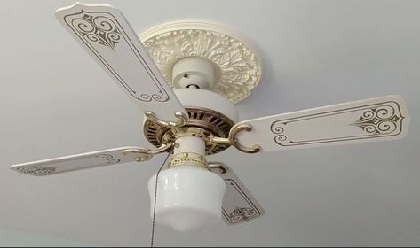 We had an old, out-dated ceiling fan in one of our bedrooms and I wanted(needed) to give it a new look. We could have gone out and bought a new fixture, but I thought it would be more fun and less expensive if I gave it an upgrade. With a little paint and elbow grease, I managed to turn this out-dated ceiling fan into something a bit more modern.    This is the original look - cream colors on the fan and base with shiny brass and gold details on the fan blades.     The first step was… Repurpose Ceiling Fan Blades, Ceiling Fan Diy, Fan Makeover, Ikea Floor Lamp, Rustoleum Chalked, Pallet Potting Bench, Rustoleum Metallic, Rustoleum Chalk Paint, Dry Brush Painting