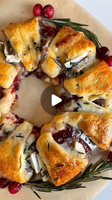 160K views · 8K likes | Ashley Lamego ♥ on Instagram: "Ep.6 Holiday Dinner Series : Easy Cranberry & Brie Wreath✨

1 package of original crescent dough 
1-2 cups of cranberry jelly (can substitute for any other jelly/jam you would like) 
1 brie 
1 egg 
Fresh Rosemary and cranberries for garnish 

Preheat oven to 375 F 
Place a small bowl upside down in the centre of your lined baking tray 
Place your crescent roll triangles overlapping around the bowl (pointy side pit) 
Spread cranberry jelly and top with pieces of baked Brie 
Fold in the crescent dough to form your wreath and remove the bowl 
Press the dough firmly around the wreath to ensure the pieces are connected 
Coat in egg wash and bake for 25-30 minutes (until golden brown). Allow to cool for 10 minutes 
Garnish with some chopped Brie And Jam Appetizer Crescent Rolls, Pastry Wreath Crescent Ring, Cranberry Brie Crescent Wreath, Cranberry And Brie Wreath, Cranberry Crescent Baked Brie, Cranberry And Brie Crescent Ring, Cranberry And Brie Puff Pastry Wreath, Baked Brie With Jam Crescent Rolls, Crescent Wreath Recipes