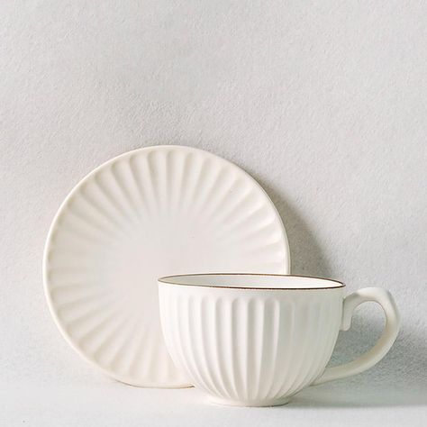 This set of 6 stoneware cups and saucers is perfect for any occasion at your home, whether it's formal or casual. The sets are available in yellow, white, or pink, so you're sure to choose a style that best complements your decor. The cups are thickly ribbed with a design that's echoed on the saucers. You're sure to grow to love this stylish collection of cups and saucers.    DETAILS   Product Type: Mugs & Teacups Color: Yellow, White, Pink Material: Stoneware  WEIGHTS & DIMENSIONS   Cup: 4'' D Teacups And Saucers, Mugs Coffee, White Cups, Cups And Saucers, Stoneware Mugs, Small Furniture, Cup And Saucer, Yellow White, To Grow