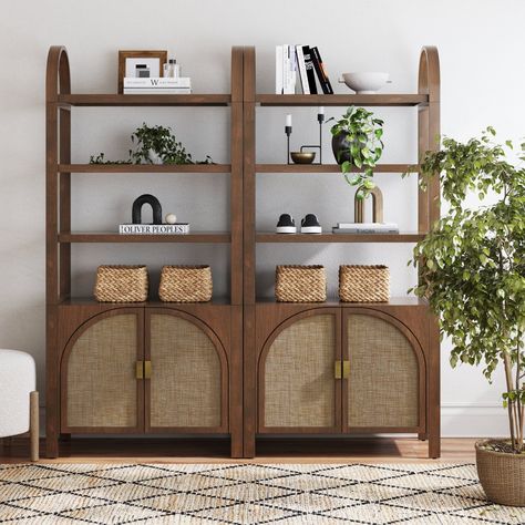 Width: 33.6 inches Height: 71.3 inches Length: 15.7 inches Introducing our latest bookshelf, Paxton, crafted with a solid wood frame and finished with a quality wood veneer that adds a touch of elegance to any room. The arched faux rattan door details bring a modern, stylish vibe, while the adjustable interior shelf offers flexibility for all your storage needs. Whether you’re setting up a cozy reading nook or organizing your favorite decor, this bookshelf is designed to sit flush side-by-side w Rattan Book Shelf, Bookshelf With Cabinet Base, Boho Bookcase, Boho Bookshelf, Bookshelf With Cabinet, Rattan Bookshelf, Wall Bar Shelf, Arched Bookcase, Bookshelf Table