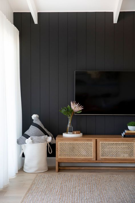 Trend Alert: Black Accent Walls | Black Accent Wall Paneling, Black Board And Batten Tv Wall, Black Coastal Living Room, Black Accent Wall Home Office, Black Board And Batten Living Room, 70 Inch Tv In Living Room On Wall, Hallway Wall Accent Ideas, Black Accent Wall Decor Ideas, Cyberspace Accent Wall