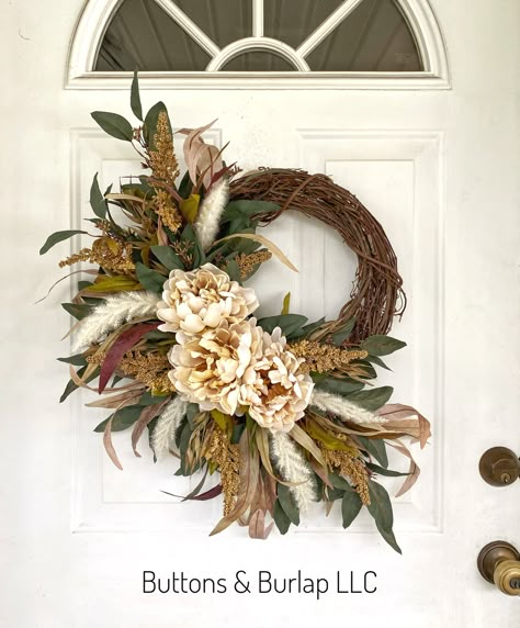 This fall wreath has cream peonies, seeded stems, and lots of flowing eucalyptus greenery. This wreath measures 22” wide and at 25” in length. Order processing time is 2 weeks. Fall Wreath With Feathers, Fall Wedding Wreaths For Door, Fall Wreaths For Front Door Diy, Wreaths For Windows Inside, Fall Wedding Wreath, Wreath With Letter, Unique Fall Decor, Western Wreath, Year Round Wreaths