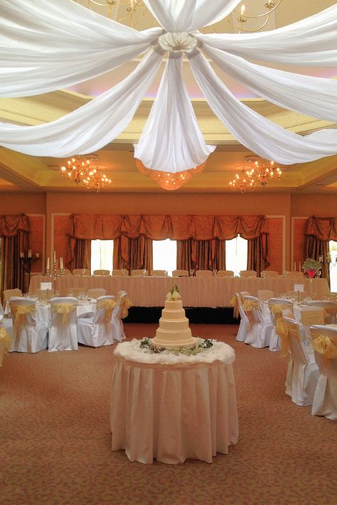 Here’s an elegant fabric draping with beautiful lighting for wedding inspiration.#WeddingIdeas #DrapingWithLights #FairyLights Ceiling Draping Wedding, Reception Ceiling, Wedding Ceiling Decorations, Ceiling Drapes, Wedding Draping, Draping Wedding, Ceiling Decorations, Wedding Ceiling, Ceiling Draping