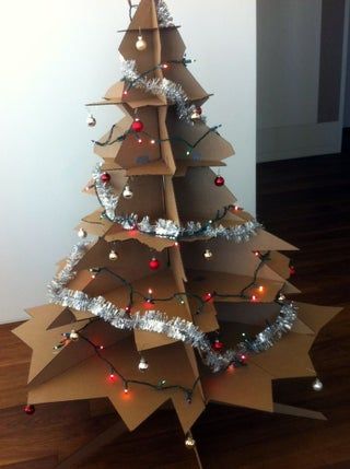 Cardboard Christmas Tree: 4 Steps (with Pictures) Christmas Lights Outdoor Trees, Snowy Backdrop, Cardboard Christmas Tree, Cardboard Christmas, Christmas Lights Outside, Diy Christmas Tree Topper, Christmas House Lights, Star Cluster, Diy Christmas Decorations