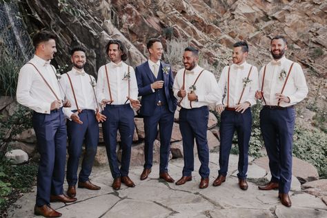 Groomsmen Navy blue suspenders champagne Navy Blue Groomsmen Suits Suspenders, Champagne Bowtie Groomsmen, Off White Groomsmen Attire, Rustic Groomsmen Attire Navy, Suspenders Groomsmen Attire, Navy Blue Tux With Suspenders, Groomsmen With Suspenders And Bowties, Groomsmen Attire Suspenders Bowtie, Navy Blue Groom And Groomsmen Suits