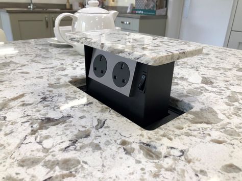 A set of handy hidden plug sockets in the counter top of this marble island Kitchen Island Phone Charger, Kitchen Island Outlet, Hidden Plugs, Hidden Kitchen Outlets, Island Outlets, Kitchen Plugs, Hidden Outlet, Kitchen Outlets, Outdated Bathroom