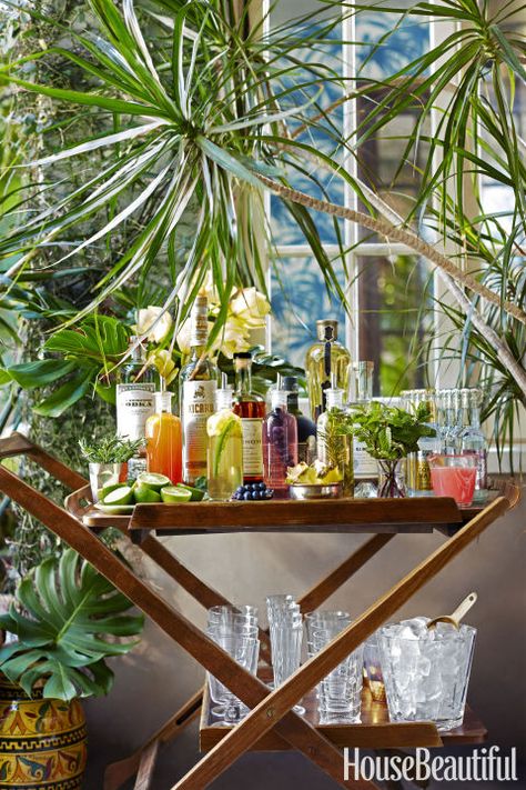 Stock the cart with small-batch flavored simple syrups in addition to top-shelf liquors, mixers and garnishes. Then just mix and match for bartender-status drinks. Click through for more summer party ideas and details that make a difference. Simple Syrups, Bandeja Bar, Entertaining Tips, Bar Cart Styling, Serving Cart, Bar Styling, Brunch Party, Backyard Party, Bar Carts