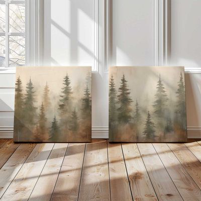 Create a serene backdrop in your space with the 'Foggy Warm Forest' art prints. This set of two features beautifully detailed pine forests, each tree fading into the misty background, all depicted in warm, earthy tones. These prints are perfect for anyone looking to add a touch of natural elegance and a peaceful vibe to their decor scheme. Millwood Pines Format: Wrapped Canvas, Overall Size: 24" H x 24" W x 1.25" D | Millwood Pines Foggy Warm Forest, Set of 2 Print on Canvas green / brownCanvas Rustic Pictures Wall Decor, Mountain Home Decor Ideas, Family Photos Decor, Earthy Home Office, Forest Green Office, Pine Forest Painting, Pine Painting, Cabin Update, Earthy Homes