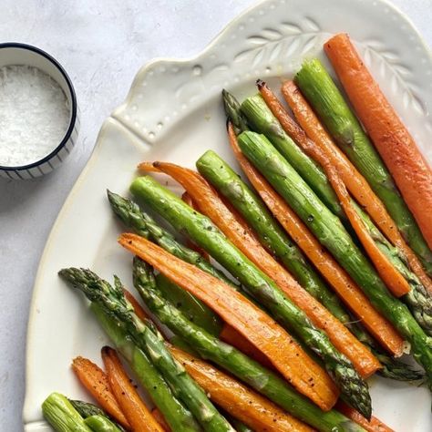 With just 3 simple ingredients and some seasoning, Roasted Asparagus & Carrots are the perfect quick vegetable side dish. With minimal prep work, this carrot and asparagus recipe can be cooked and on the table in less than 30 minutes. #HalfYourPlate #Asparagus #Carrots #SideDish #Vegan #VeganSidedish Asparagus Mixed Veggies, Roasted Carrots And Asparagus Recipes, Asparagus Carrots Recipes, Side Dish Asparagus, Carrots Asparagus Roasted, Easter Asparagus Recipes, Asparagus And Carrots Recipes, Asparagus Medley, Roasted Carrots And Asparagus