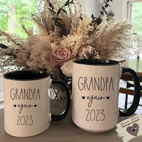 Cute Farmhouse Skinny Font Grandpa Again 2023 Mug, or personalize with any year or nickname! Available in 11oz or 15oz Large Size and with black handle. Buy Now!  *Matching Grandma Again 2023 mug here: https://etsy.me/3u0eAJH ✔ Let this adorable coffee mug help you with your new baby announcement this Christmas and holiday season, or as a birthday surprise, or baby reveal! ✔ Grandpa To Be - The most exciting moment in life HAS to be finding out you're going to be a GRANDPARENT...AGAIN! (YEP! I k Going To Be A Grandma, New Grandparent Gifts, Grandpa Christmas, Grandma To Be, First Time Grandma, New Baby Announcement, Gigi Gift, Great Grandma Gifts, New Grandparents