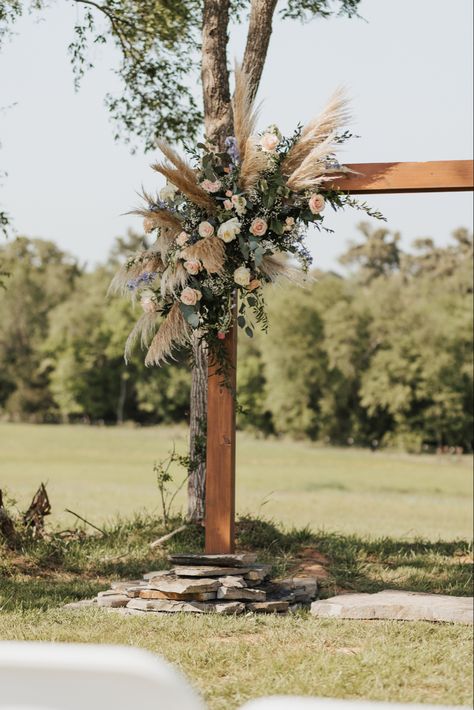 Wooden wedding are with a bohemian style flower arrangement. Wooden Flower Arch Wedding, Flowers On Arch Wedding, Bohemian Wedding Arch, Wooden Wedding Arch, Wood Wedding Arches, Wooden Wedding Arches, Rustic Flower Arrangements, Wedding Arbor Rustic, Boho Wedding Arch