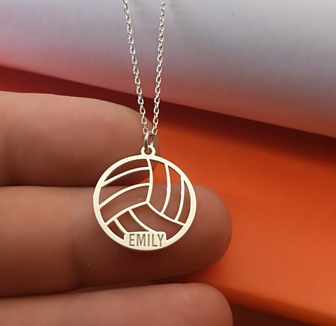 Sport Volleyball pendant in Sterling Silver number and name silver necklace , volleyball name  jewelry, silver sport number, sport mom gift VOLLEYBALL SIZE : 21 MM X 20 MM Metal: 925 Sterling Silver Thickness: approx. 1mm Chain: 925 Sterling Silver The Sport Volleyball Pendant in Sterling Silver is a stylish and personalized necklace that celebrates the passion for volleyball. This custom necklace features a volleyball pendant with the option to engrave a player's number and name, making it a pe Volleyball Necklace Jewelry, Volleyball Gift Ideas, Volleyball Crafts, Sport Jewelry, Volleyball Necklace, Volleyball Jewelry, Sports Mom Gifts, Volleyball Designs, Sport Mom