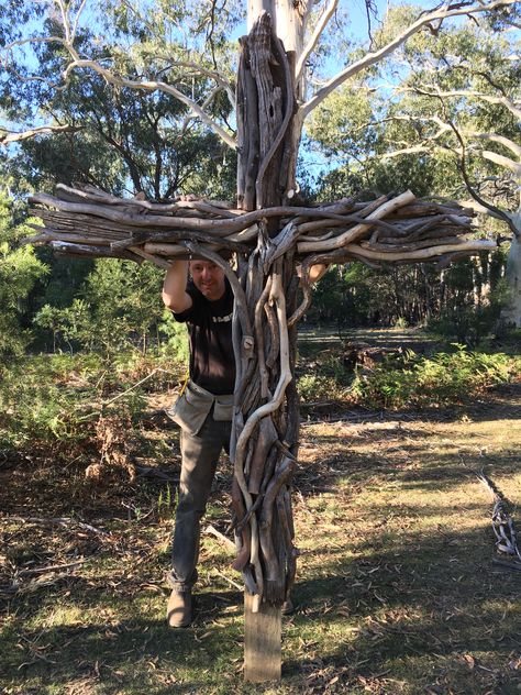 A large LifeSize cross we made from tree branches for our outdoor chapel! #cross #outdoorchapel #chapelinthewoods #easter #church #jesus #prayerstation Wood Crosses For Cemetary, Yard Crosses Wooden, Cross Made From Tree Branches, Outdoor Worship Space, Christian Yard Decor, Diy Outdoor Cross, Prayer Garden Ideas Backyards, Catholic Garden, Justice Band