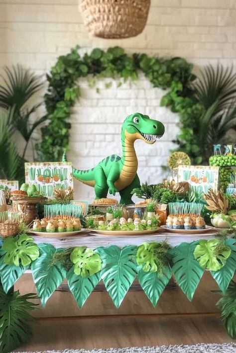 Dinosaur birthday idea Dinosaur Birthday Party Food Table, Dinasour Party Theme Ideas, Fourth Birthday Dinosaur Theme, Dinosaur Birthday Party Table Decor, Dinosaur Themed 3rd Birthday Party, Three Rex Birthday Party Boy Decorations, Dinosaurs Birthday Party Ideas, The Good Dinosaur Party Ideas, Dinosaur Party Ideas Decorations