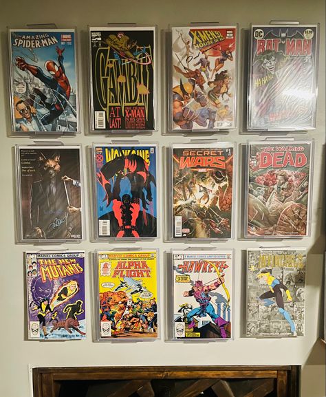 Great way to display your favorite books. Enjoy displaying my favorites and its super easy to swap out. Always gets compliments on the display. Comic Book Display Ideas, Comic Book Shelf, Book Display Ideas, Comic Display, Comic Book Display, Comic Book Frames, Shelf Stand, Book Wall, X Man