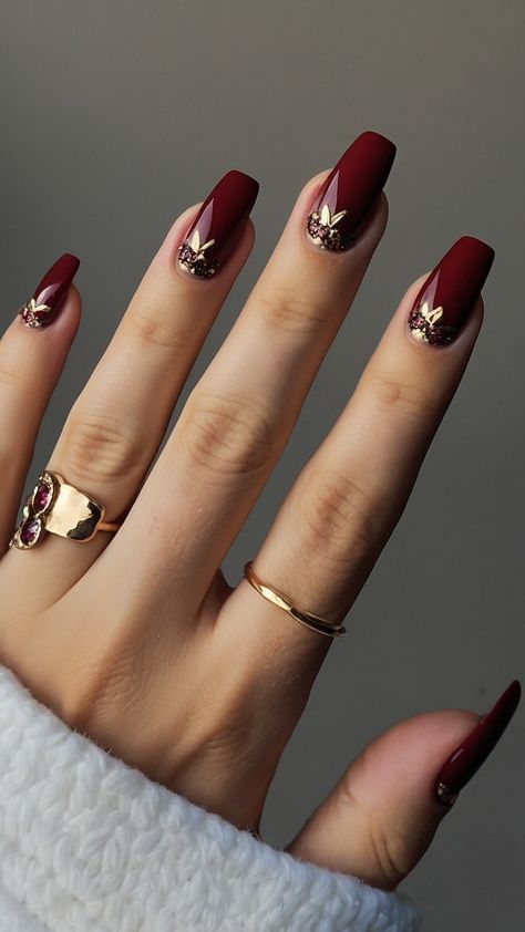 Achieve classy burgundy nails with these dark red design ideas for a polished French tip look From classic black to short and chic explore artful nail designs including chrome and acrylic short nails Get inspired by these elegant burgundy nail design suggestions for a stylish and sophisticated manicure Burgundy And Gold Nails Short, Dark Red Autumn Nails, Burgundy And Chrome Nails, Deep Red Nails With Gold, Fall Red Nails Designs, Burgundy Fall Nails Designs, Dark Red And Gold Nails, Christmas Nails Burgundy, Nails Ideas Burgundy