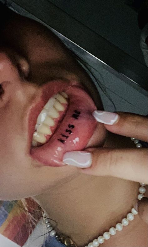 Lip tattoo idea kiss me Cool Lip Tattoos Ideas, Tattoo On Lips Ideas, Make Me Lip Tattoo, Inside Mouth Tattoo, Inner Lip Tattoo Aesthetic, Tounge Tattoo Ideas, Inside Lip Tattoos Ideas, Lower Lip Tattoo, Mouth Tattoo Inner Lip