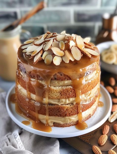 Banana Almond Caramel Layer Cake  🍰    Ingredients:🍌 Cake Layers:🍌 - 2 cups all-purpose flour - 1 cup almond flour - 1/2 cup granulated sugar - 1 cup unsalted butter, softened - 6 large eggs - 2 tsp vanilla extract - 1 tsp baking powder - 1/2 tsp salt - 1 cup milk Caramel Layer Cake, Almond Caramel, Hot Cake, Dessert Cookbooks, Cake Layers, Caramel Cake, Banana Cake, Cake Ingredients, Granulated Sugar