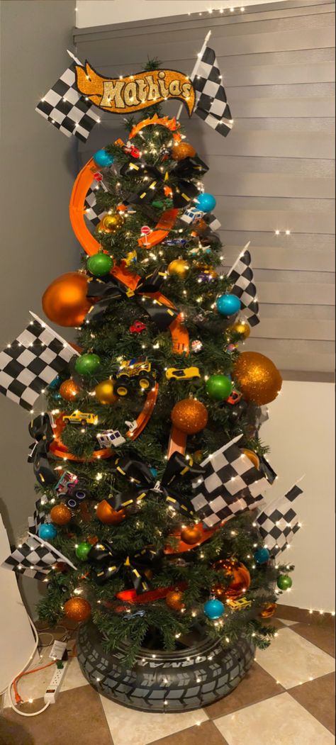 Junky Christmas Trees, Kid Tree Christmas, Cars Theme Christmas Tree, Christmas Tree Decor Ideas For Kids, Race Car Christmas Tree Ideas, Hot Wheel Christmas Tree, Car Themed Christmas Tree, Toddler Christmas Tree Ideas, Monster Jam Christmas Tree