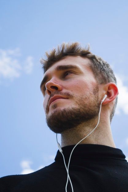 Low angle portrait of a man looking away | Free Photo Looking Up Portrait Photography, Head From Different Angles Photography, Low Angle Portrait Reference, Face At Angles, Portrait Reference Extreme Angles, Face From Down Angle, Perspective Portrait Photography Angles, Face Perspective Reference Photo, Extreme Angle Portrait