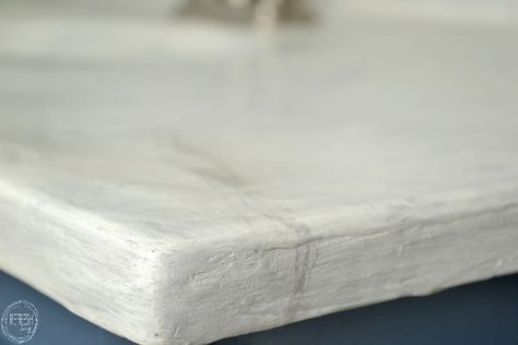 Easy DIY concrete countertops can be installed right over your old countertop surface using a feather finish flooring concrete. Feather Finish Concrete Countertops, White Concrete Countertop, Drop Cloth Slipcover, Diy White Concrete Countertops, Paint Tiles, Diy Concrete Counter, Natural Stone Counter, White Concrete Countertops, White Granite Countertops